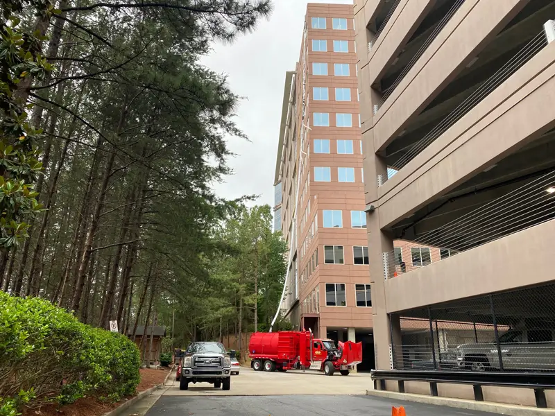 Vacuum excavation team performing safe digging near pipelines